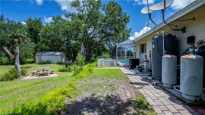 View of yard featuring a storage unit