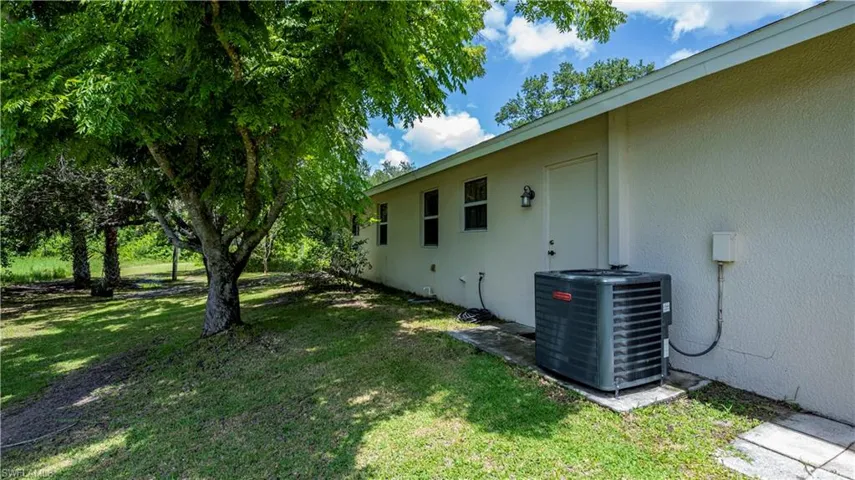 View of yard featuring central AC unit