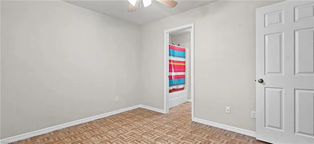 Spare room with parquet floors and ceiling fan