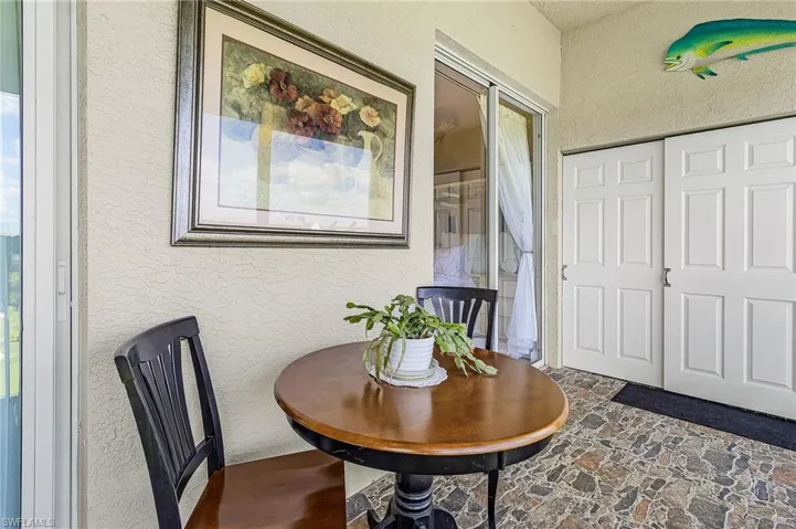 Extra long lanai houses the laundry area behind the sliding doors. The master bedroom can be accessed from here, too.