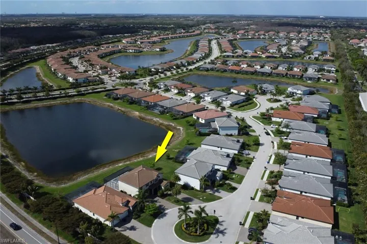 View of property location with nearby suburban area and a large body of water
