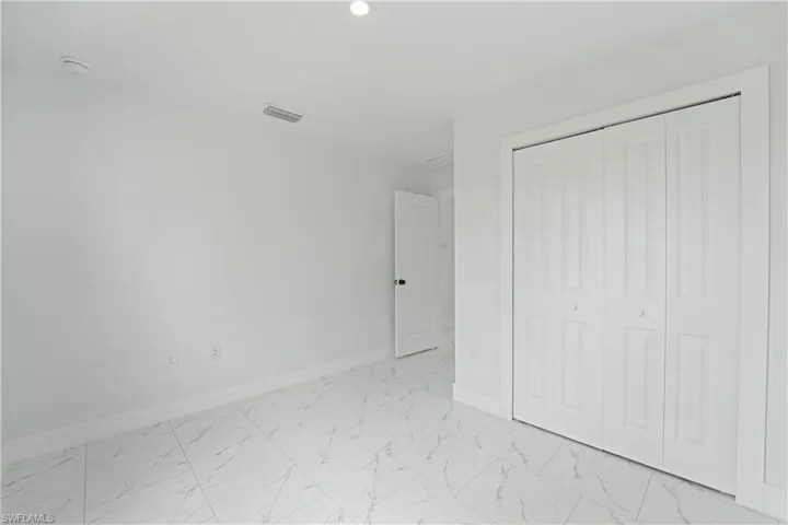 White tile flooring with subtle veining