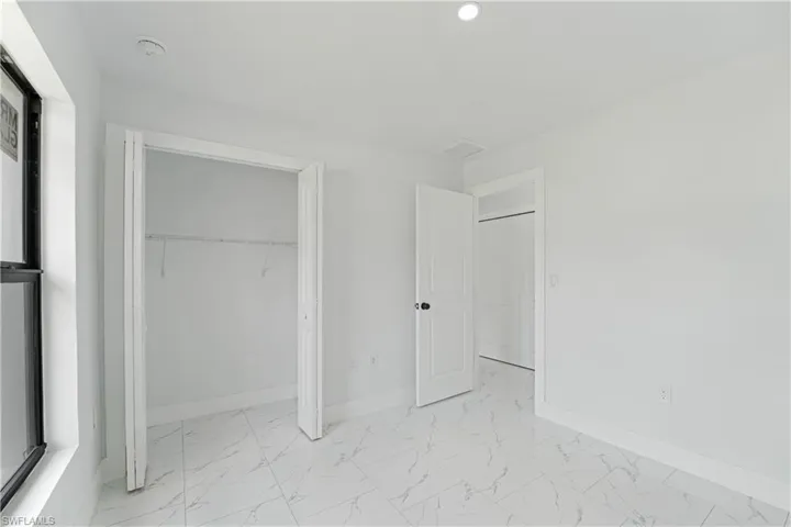 White tile flooring with subtle gray veining