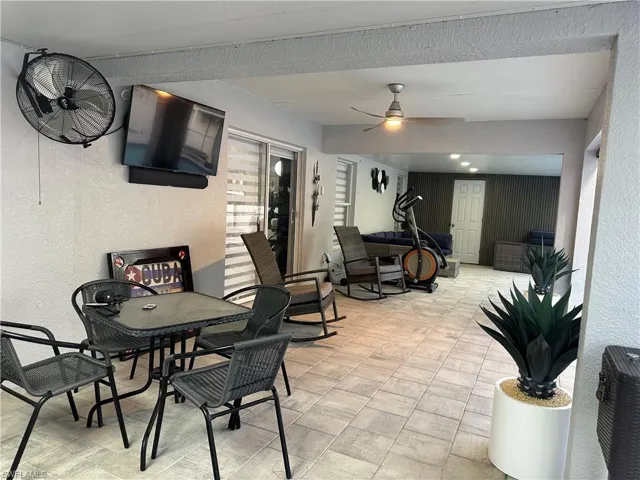 View of patio featuring a ceiling fan and outdoor dining area