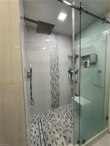 Bathroom featuring a shower stall