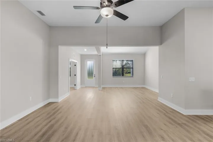 Entryway featuring wood tiled floors and baseboards