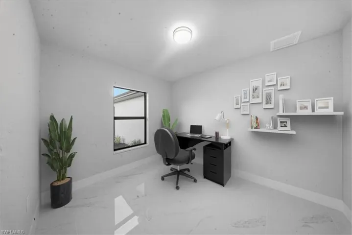 Office area featuring light marble finish flooring and baseboards