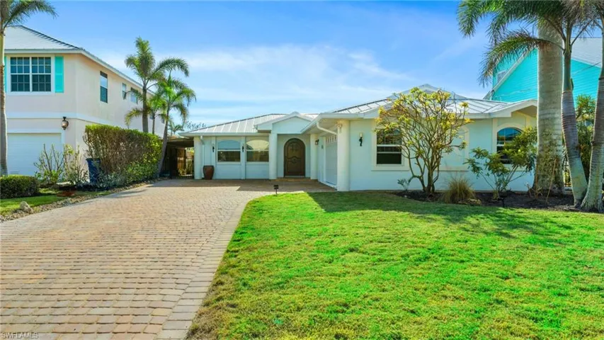 View of front of house with a front yard