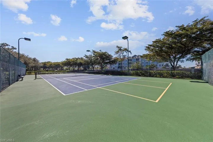View of tennis court featuring basketball court