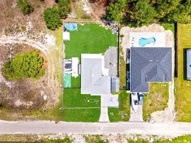 Aerial perspective showcasing two distinct properties