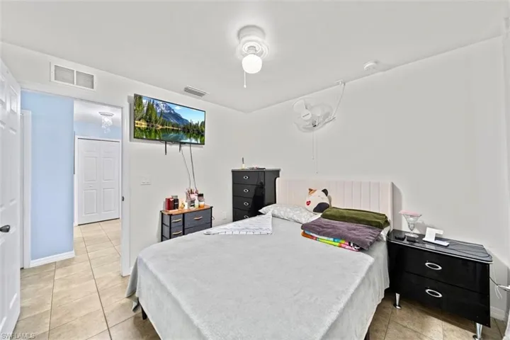 Neutral-toned tile flooring throughout