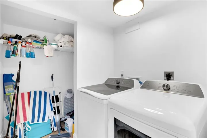 Washroom featuring washer and dryer