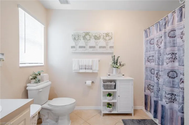 Primary bathroom with tub & shower combination