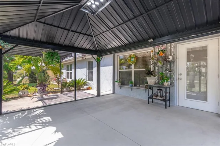 View of patio / terrace with spacious screened gazebo