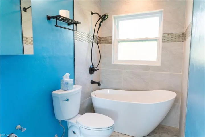 Bathroom with toilet and a tub