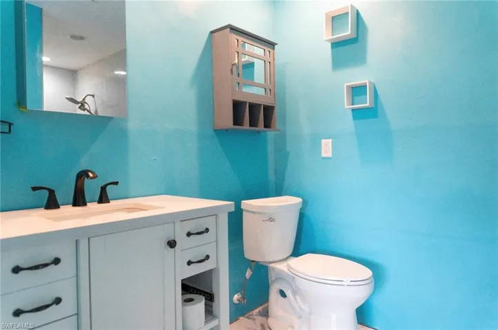 Bathroom with vanity and toilet