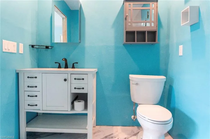 Bathroom featuring vanity and toilet