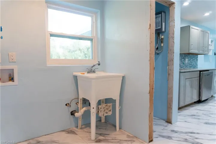 Bathroom featuring tasteful backsplash