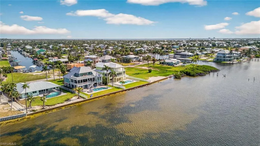 Aerial view of residential area with a large body of water
