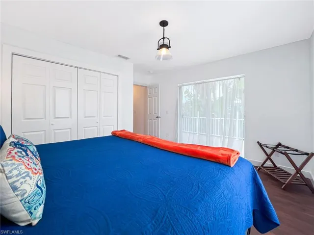 Upper Level Bedroom with sliding door to open balcony