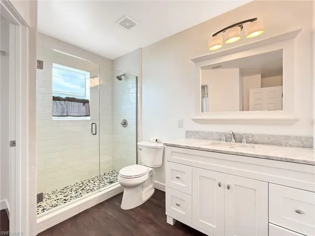 Upper Level Bathroom with an enclosed shower, oversized vanity, Subway Tile and Granite Vanity Top