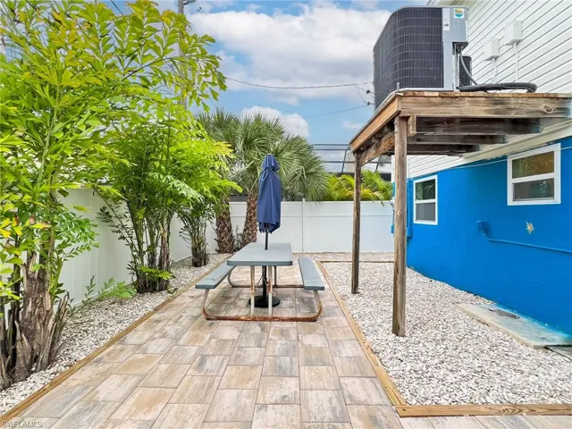 Rear yard with new pavers and Sea Shell ground cover