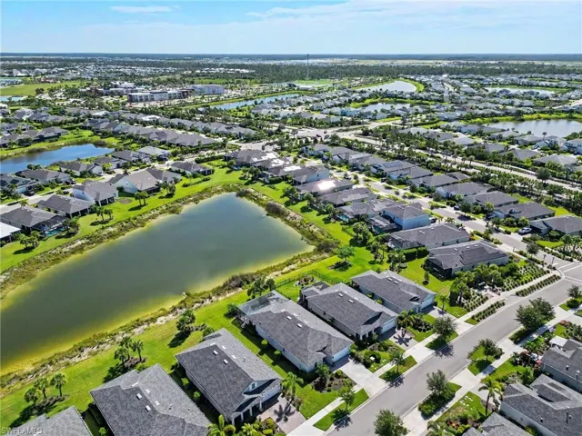 Residential community featuring numerous single-family homes, multiple retention ponds, and established landscaping
