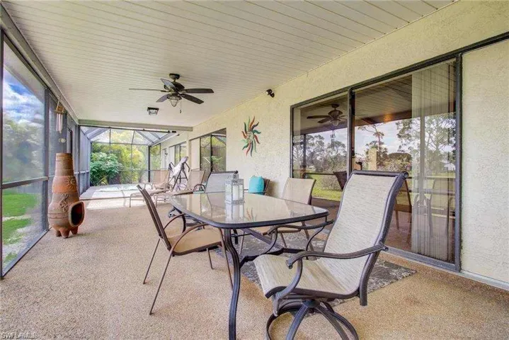 Sunroom / solarium featuring ceiling fan