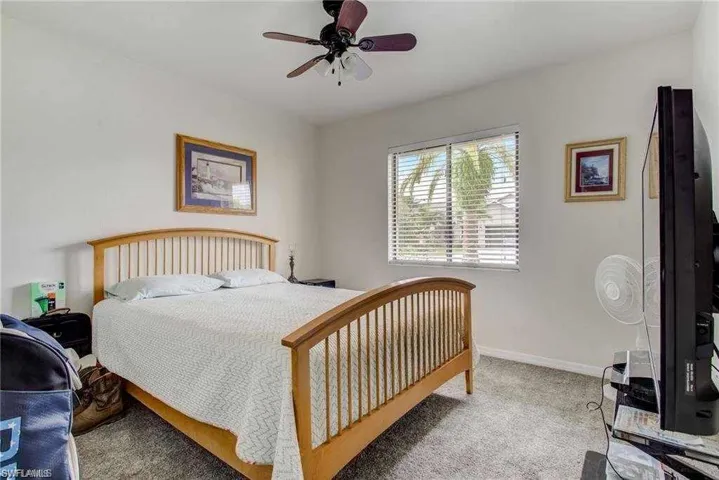 Bedroom featuring carpet flooring and ceiling fan