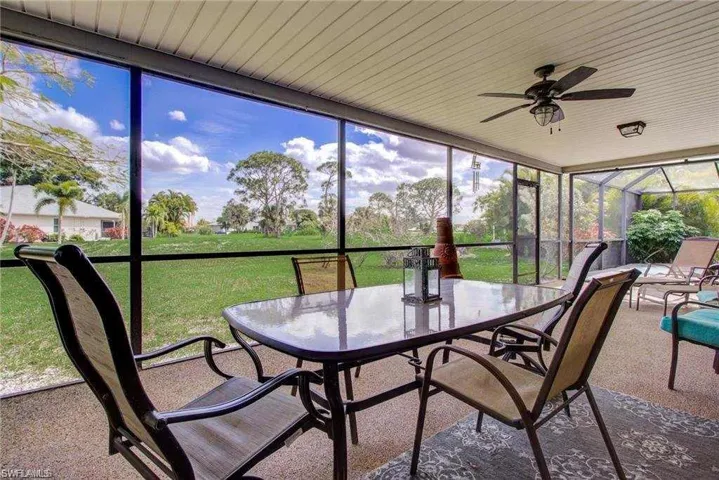 Sunroom featuring ceiling fan