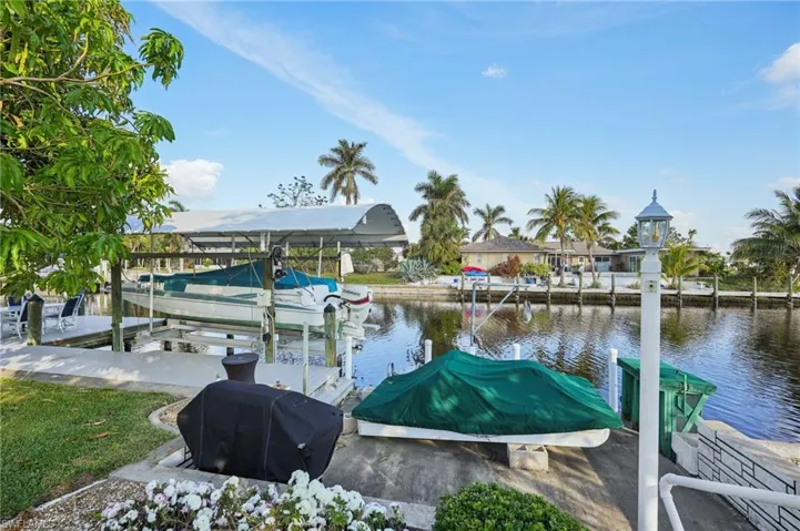 Dock area featuring a water view