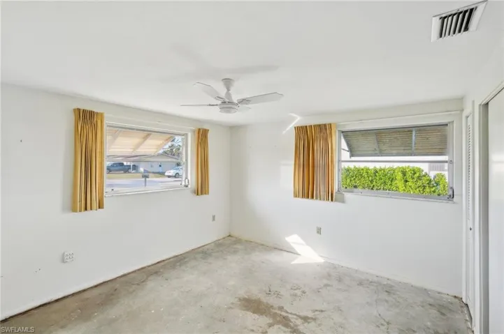 Unfurnished room featuring ceiling fan