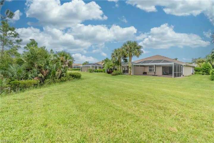 View of yard with a lanai