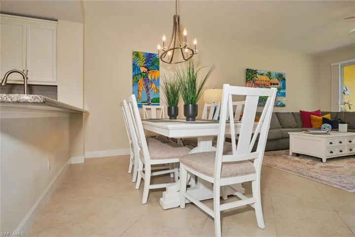 Dining room featuring a chandelier and light tile patterned floors