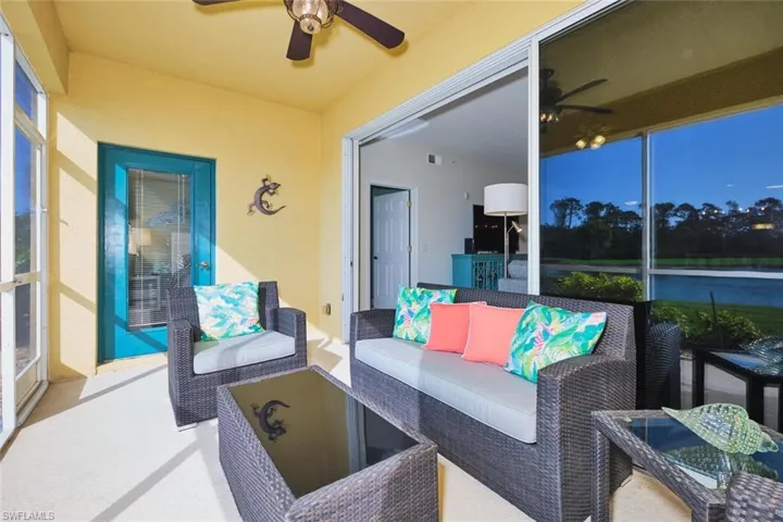 Sunroom / solarium with ceiling fan, outdoor lounge area, and healthy amount of natural light