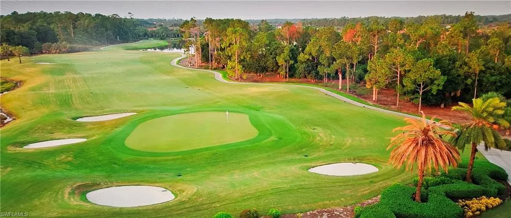 View of home's community featuring golf course view and a water view