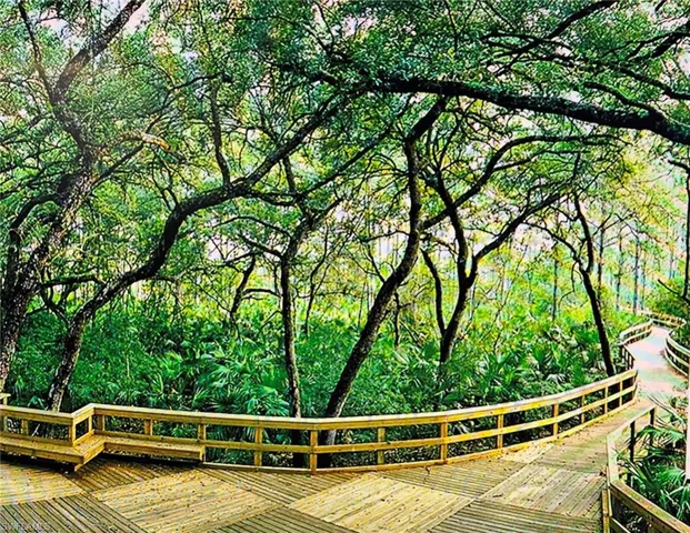View of community featuring a wooded view