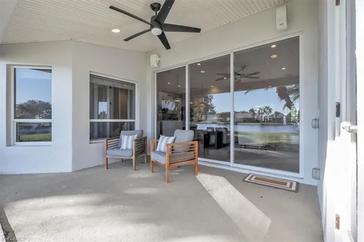 View of patio featuring a ceiling fan and a water view