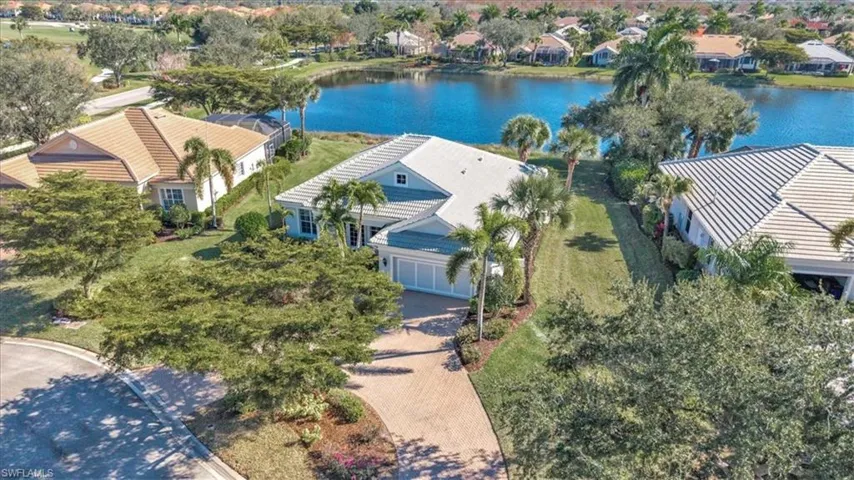 Aerial perspective of suburban area with a nearby body of water