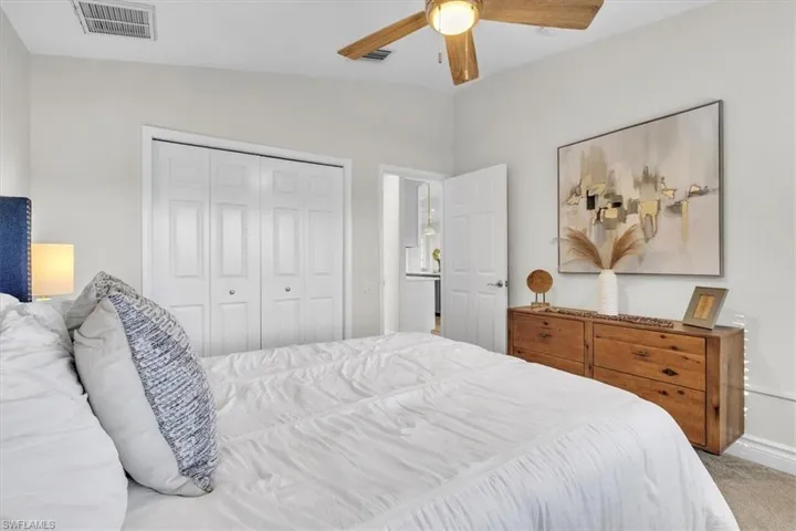 Bedroom featuring carpet, a closet, and ceiling fan