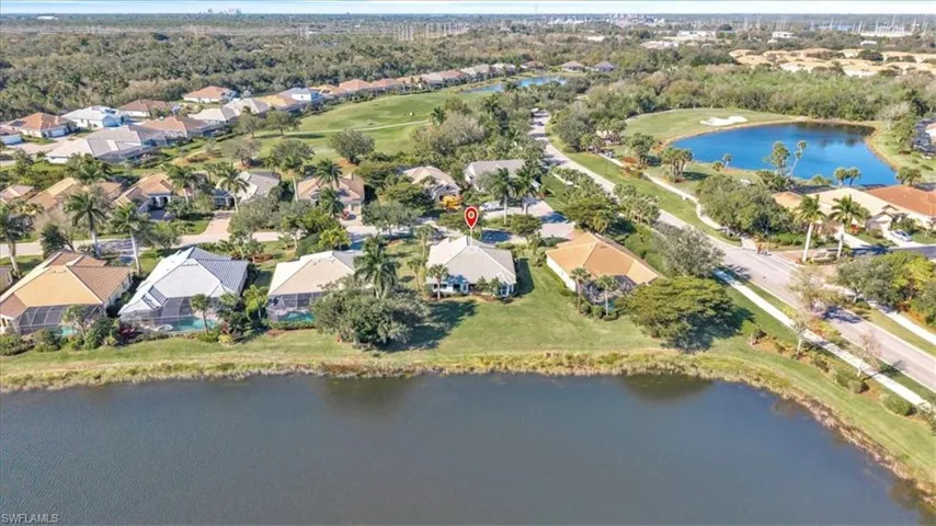 View of property location with a large body of water and nearby suburban area