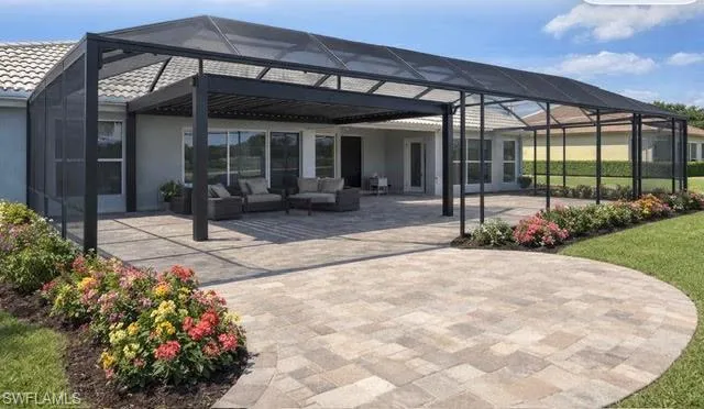 Moc up of Back of house featuring glass enclosure, a sunroom, a patio, and an outdoor living space with pergola