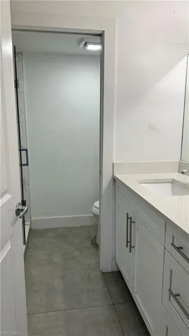 Bathroom featuring vanity and toilet