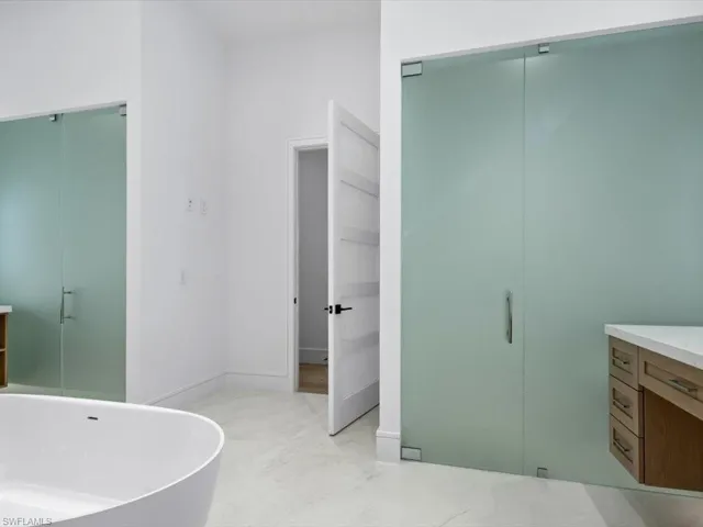 two glass enclosed water closets
