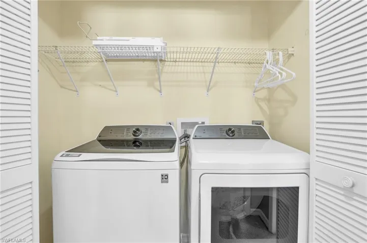 Laundry area featuring washer and clothes dryer