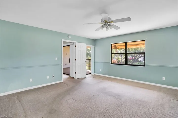 Unfurnished bedroom featuring carpet and ceiling fan