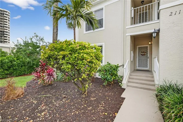 Property entrance featuring stucco siding