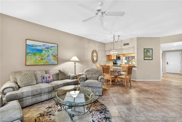 Living area featuring ceiling fan and recessed lighting