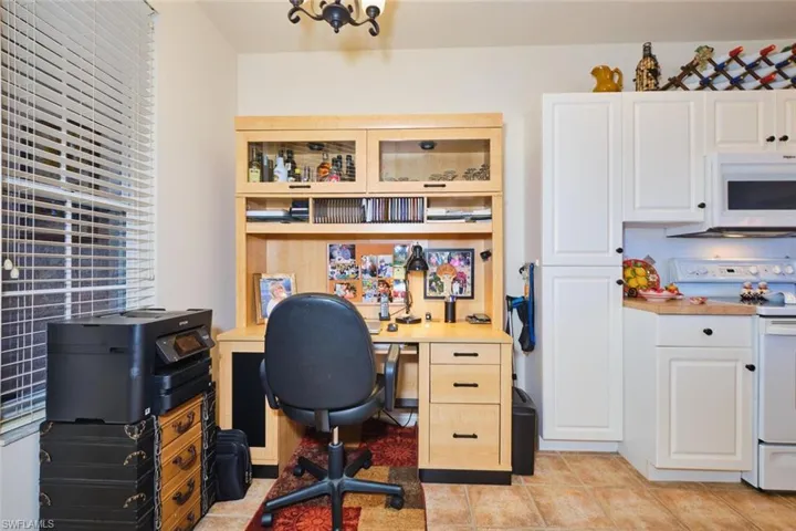 Home office featuring light tile patterned floors
