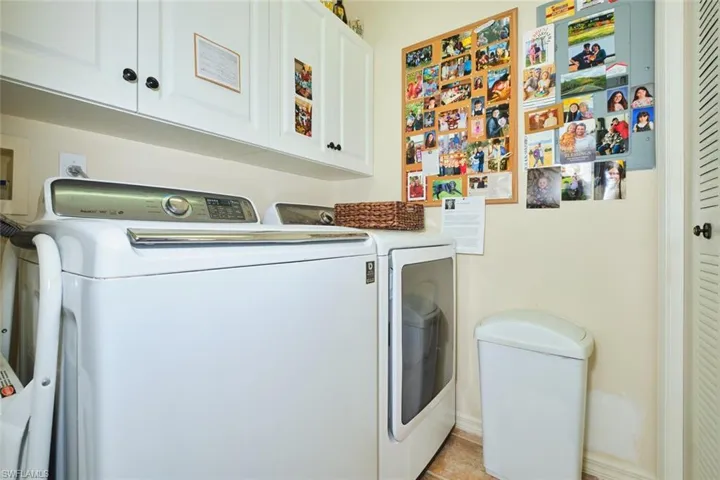 Laundry room with cabinet space and washer and dryer
